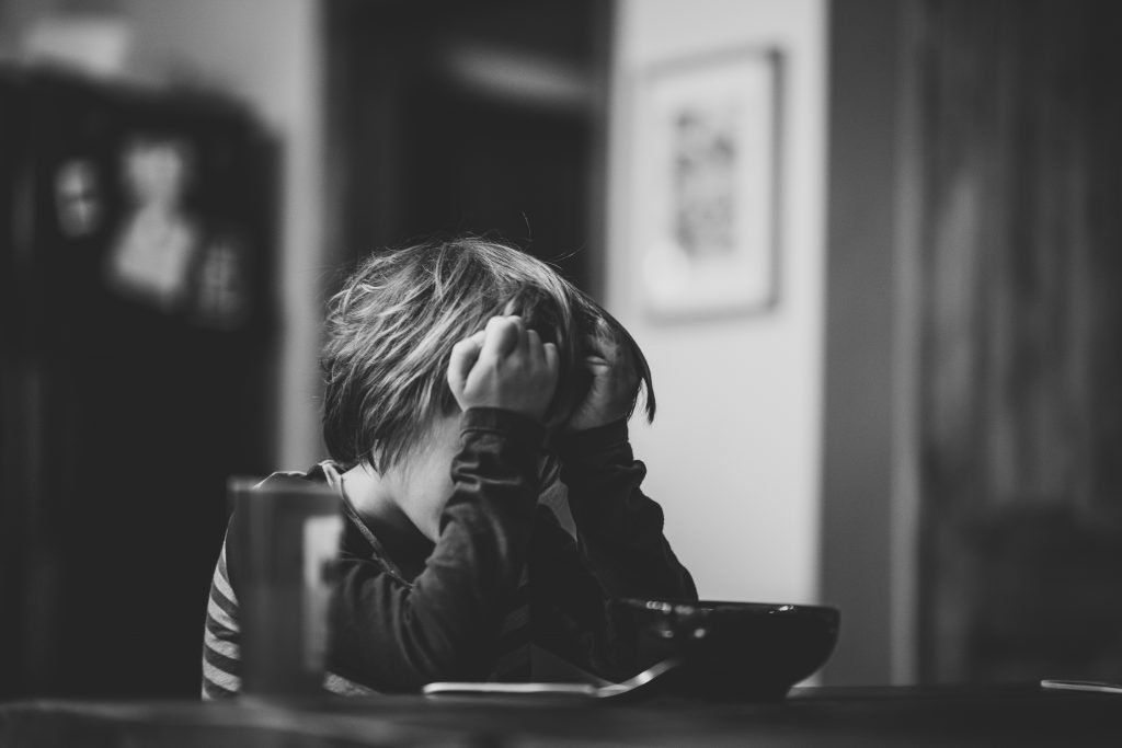 Tired child at breakfast